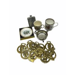 Group of Royal commemorative horse brasses, pewter hip flask, silver plated three handles cup, two Royal commemorative mugs, and boxed small Royal commemorative dish. 