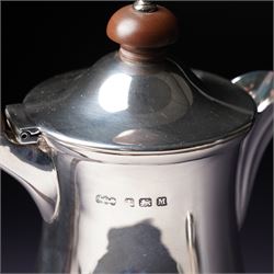 Silver three piece tea set of panelled circular form Birmingham 1929 Maker Synyer & Beddoes and a similar hot water jug Sheffield 1954 