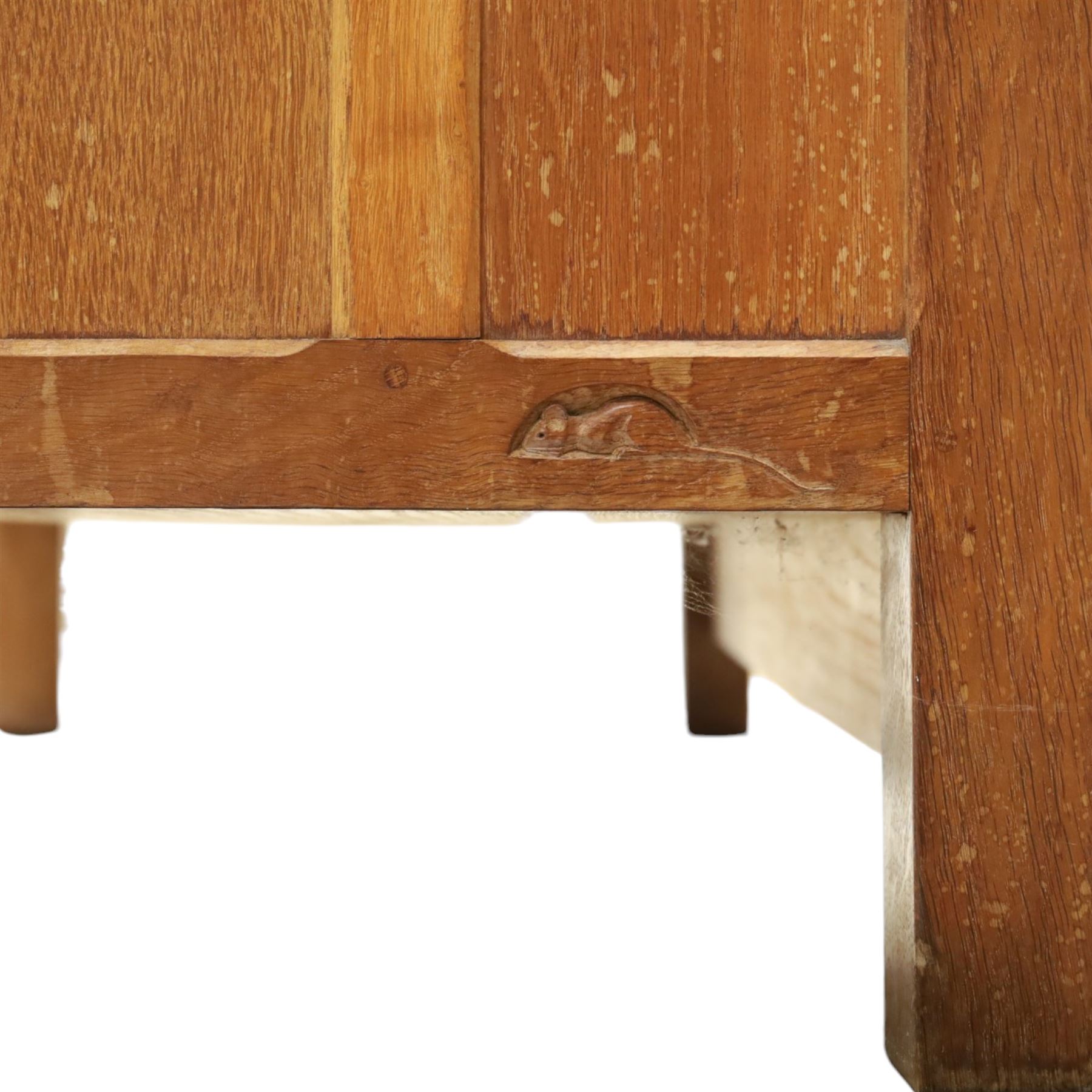 Mouseman - early-to-mid-20th century panelled and adzed double wardrobe, the arcade carved cresting rail over two panelled doors, with wrought metal hinges and latch, deep relief carved mouse signature, the interior fitted with hanging rail, by the workshop of Robert Thompson of Kilburn