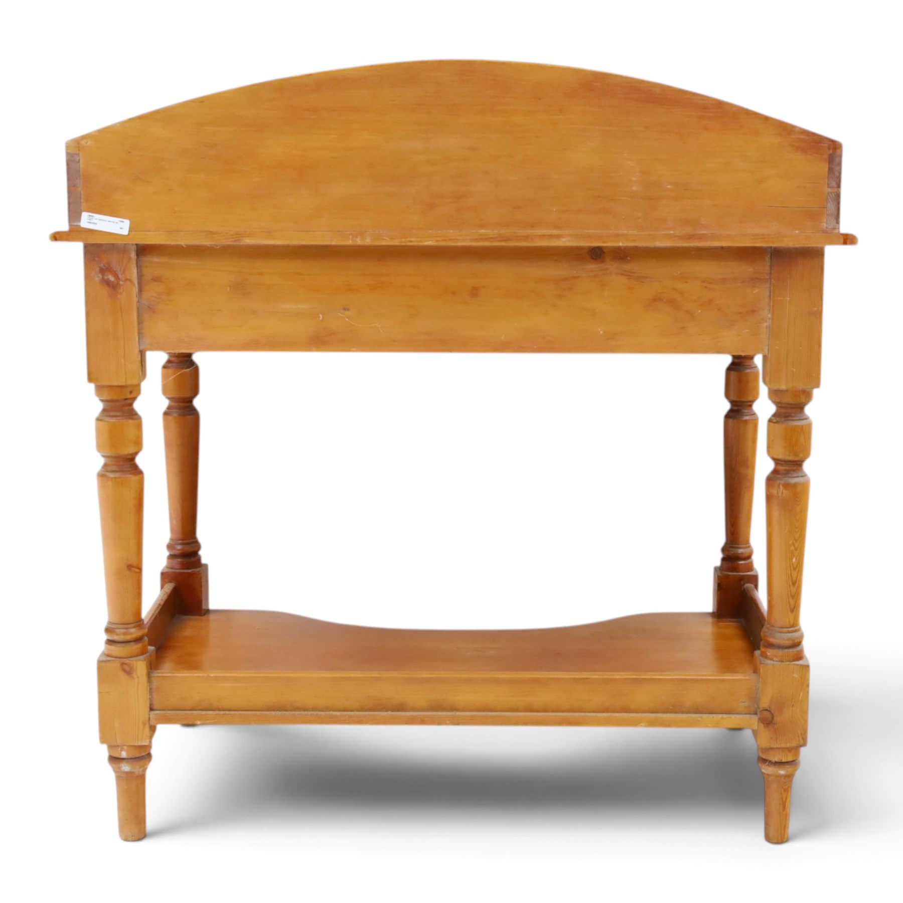Victorian pine washstand, raised three quarter galleried top, fitted with two drawers, raised on turned supports united by a shaped full length under tier 