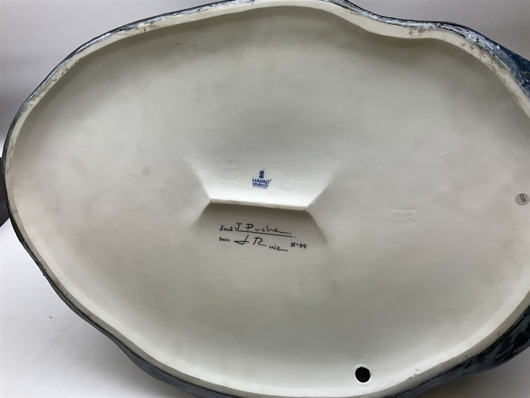 Large Lladro figure, La Menina, modelled as a maid of honor in service, on a mahogany oval base, limited edition 99/1000, sculpted by Jose Puche, with certificate of authenticity, framed and glazed, no 1812, year issued 1996, year retired 2019, H60cm