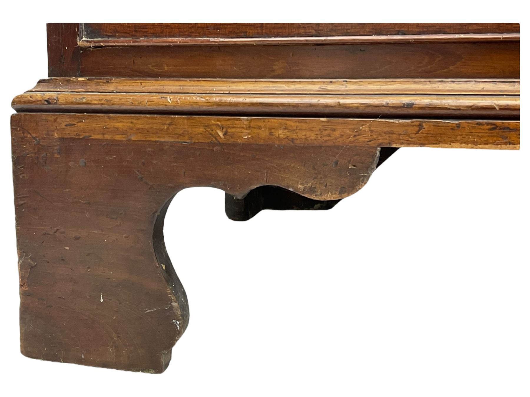 George III mahogany bureau, the conch inlaid fall front enclosing pigeon holes, shelves and central cupboard with inlaid flower motif, four graduating cock-beaded drawers below each with brass handles, lower moulded edge over shaped bracket feet