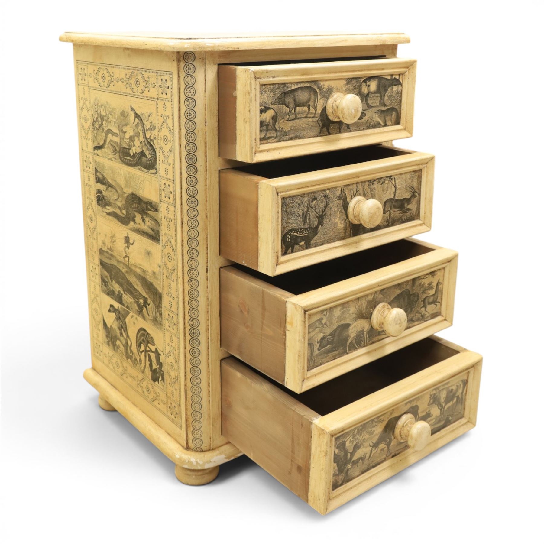 Traditional design cream painted lacquered pedestal chest, rounded moulded top over four short drawers, the drawer fronts decorated with monochrome printed animal scenes, conforming foliate and geometric borders to the top and sides, turned handles, on bun feet