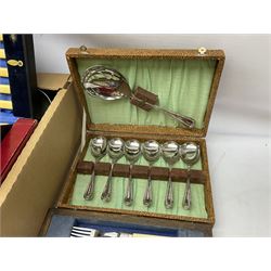 Collection of silver plate and metalware, to include egg cup holder, cased set of fish servers with with silver ferrules, tea set comprising of teapot, jug and open sucrier, brass candlesticks etc, in two boxes 