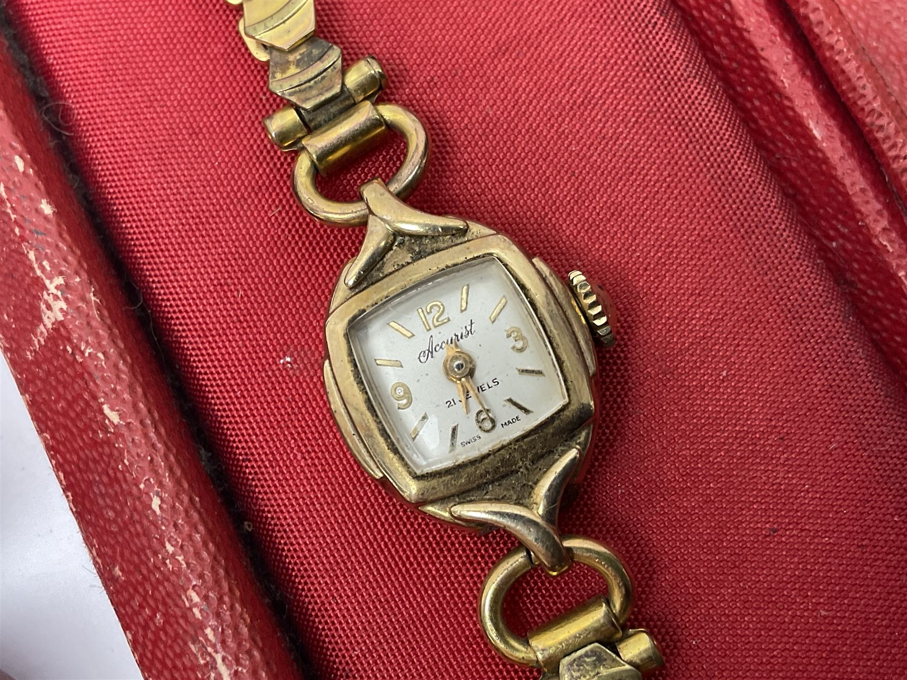 Ladies Accurist 9ct gold manual wind wristwatch, on gilt metal bracelet, together with a silver and enamel fob, for the Transport and General Workers Union, with personal engraving to reverse, hallmarked, a safe driving medal and a Quartz wristwatch