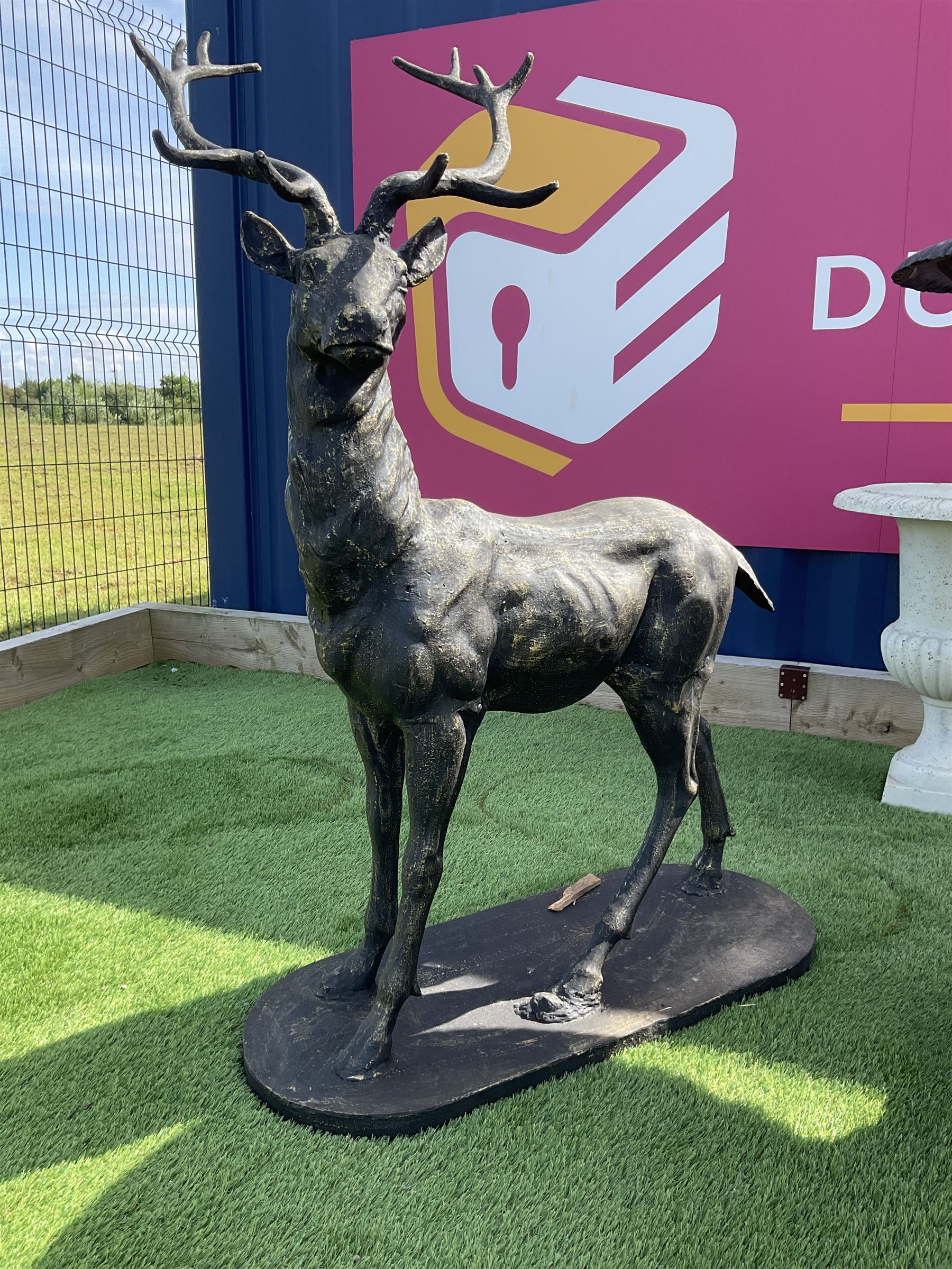 Pair of cast iron life-size garden stags, bronze finish on oval plinth bases H154, W105, D50 - THIS LOT IS TO BE COLLECTED BY APPOINTMENT FROM DUGGLEBY STORAGE, GREAT HILL, EASTFIELD, SCARBOROUGH, YO11 3TX