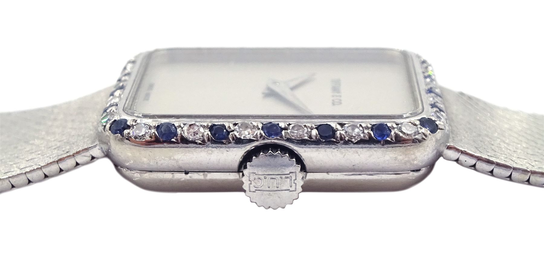 Tiffany & Co ladies 18ct white gold manual wind wristwatch, movement by Chopard, diamond and sapphire bezel, case stamped 18K with Helvetia hallmark, on 18ct white gold integral bracelet, stamped 750