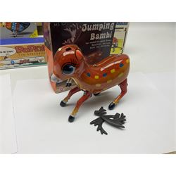 Twenty six tinplate models to include Ferris Wheel and Performing Circus Elephant, marked JW, further similar examples such as Duck on a Bike, Clown on Roller, Carousel; Popeye Tin Speedboat; Looney Tunes Wind Up Cars and Express Train; various international examples, MS107 Jumping Bambi, Pop Pop Boat, jumping frogs, pecking chickens etc; both boxed and loose