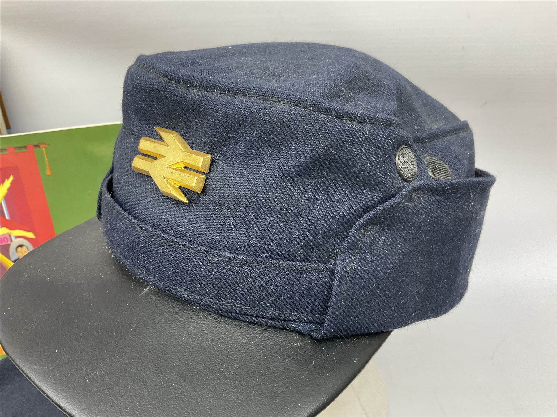 Black painted three colour railway lamp with revolving filters, H29cm; BR Acme Thunderer whistle; three railway peaked caps, two with BR Intercity 125 badge; small album of photographs of railway interest etc