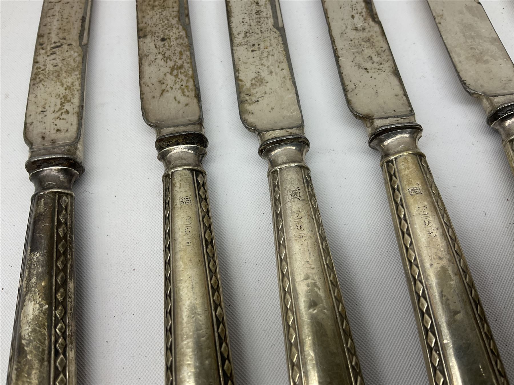 Set of six silver handled butter knives, and a silver handled shoehorn, all hallmarked, but hallmarks worn and indistinct