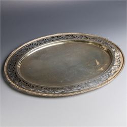 Indian silver waiter, of oval form with pierced foliate decoration, W31cm