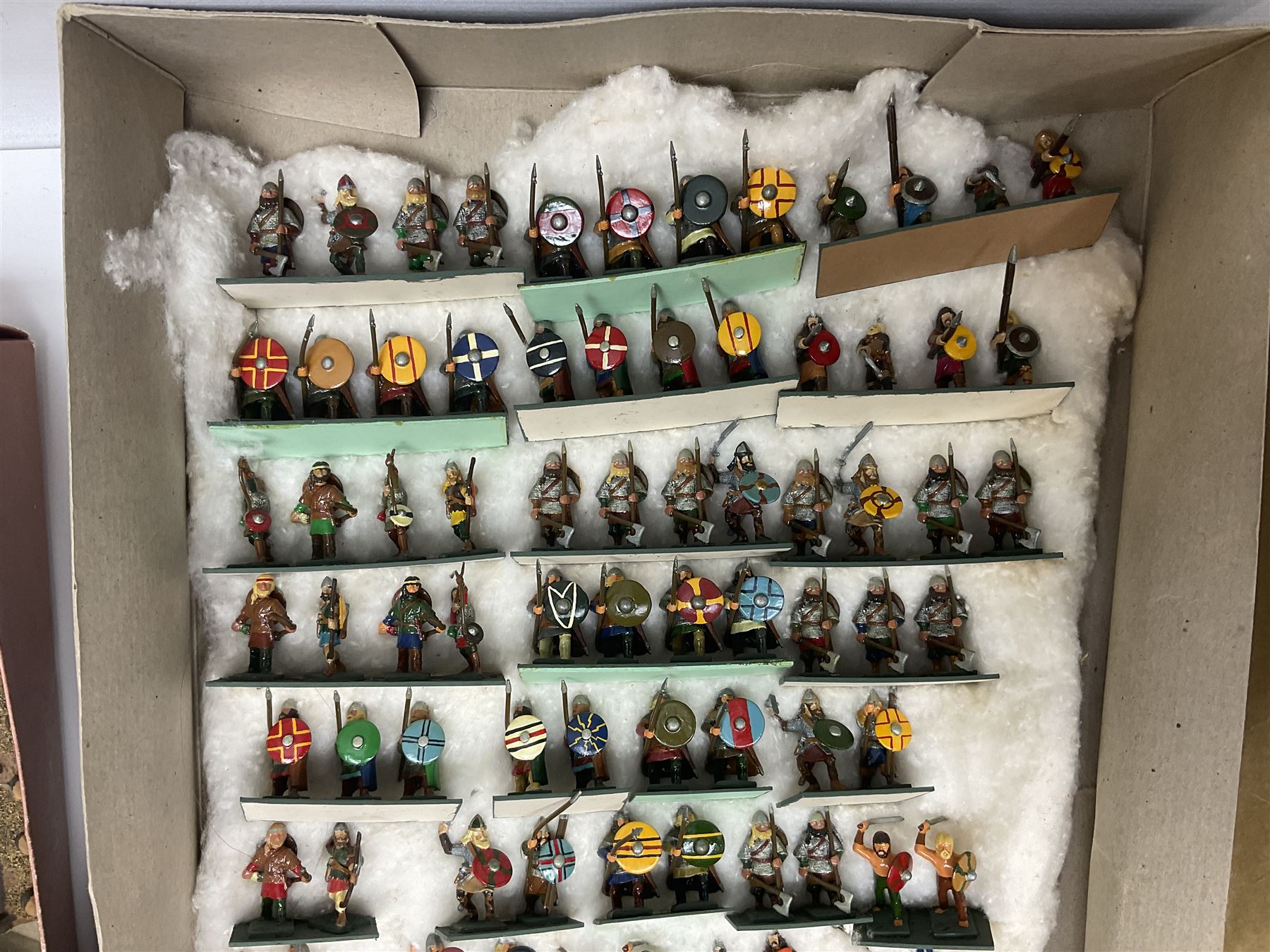 Painted metal wargame figures - over four hundred including Normans and Saxons, Romans, British Tribes etc; together with a quantity of part-painted and unpainted figures, battlefield weapons and accessories etc; average size 25mm