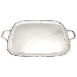 Raich Carter - presentation hallmarked silver two-handled tray of rounded oblong form with gadrooned rim by Wilson & Gill, 139 Regent Street, London, inscribed to the centre 'Presented to Mr. & Mrs. Raich Carter by the Lord Mayor of the City and County of Kingston-upon-Hull Alderman R.E. Smith J.P. on May 30th 1952on behalf of the many Admirers who subscribed to The Lord Mayor's Testimonial Fund in recognition of Raich Carter's genius as a footballer and his services to the City', London 1937 82oz L61cm; together with a hallmarked silver four-piece tea and coffee set by Cooper Bros. & Sons Ltd, the teapot of London shape with ebonised handle and knop, each piece engraved with an initial 'C', Sheffield 1920  60.5oz, teapot L29.5cm