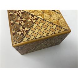 Japanese parquetry puzzle box L12cm; another Japanese puzzle box with marquetry top of Mount Fuji; eleven graduated Chinese figures including immortals; and Chinese figure of a lady standing on a hardwood base next to a horn table (14)