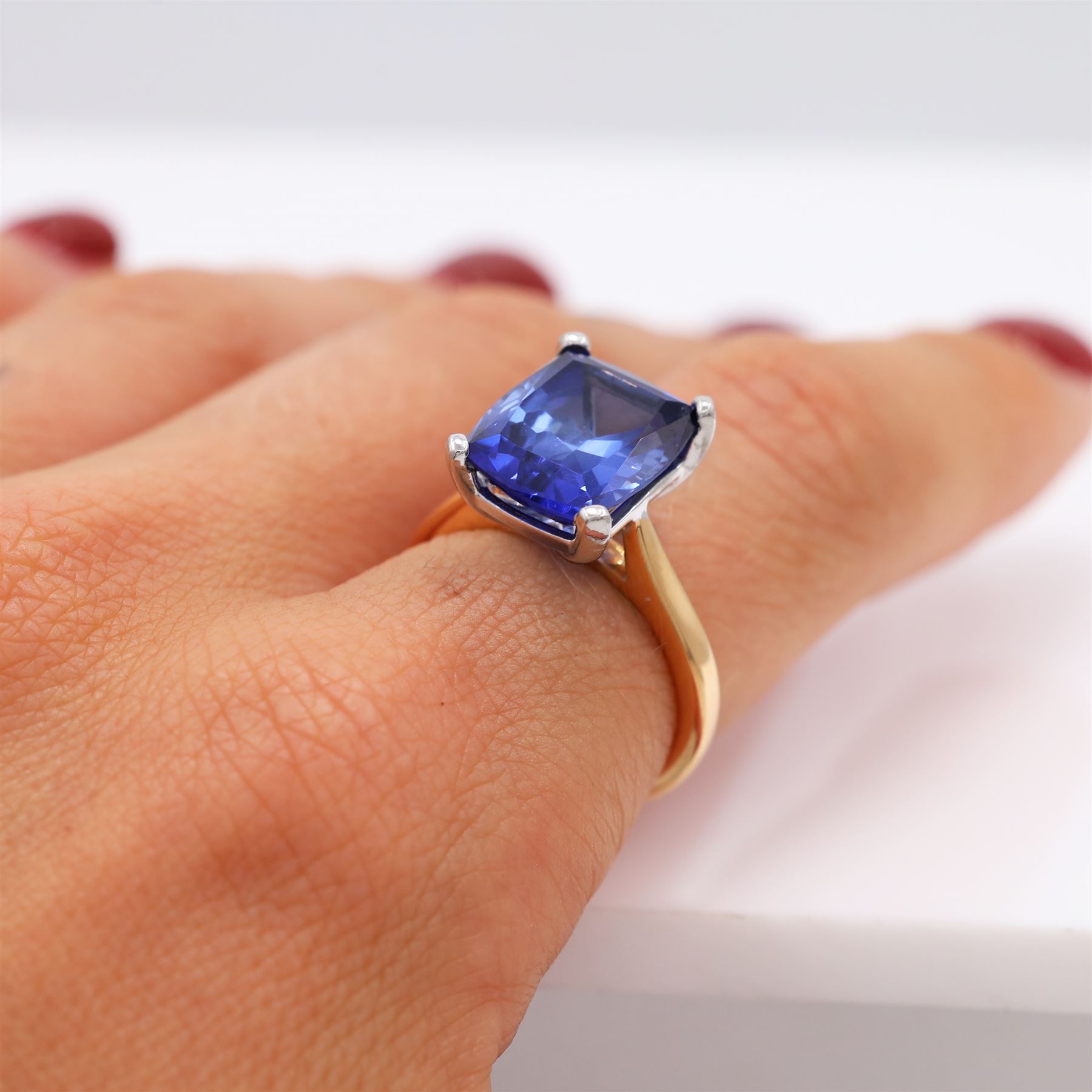 18ct rose gold and platinum synthetic sapphire ring, set with a single cushion cut sapphire of approx 6.95 carat, hallmarked