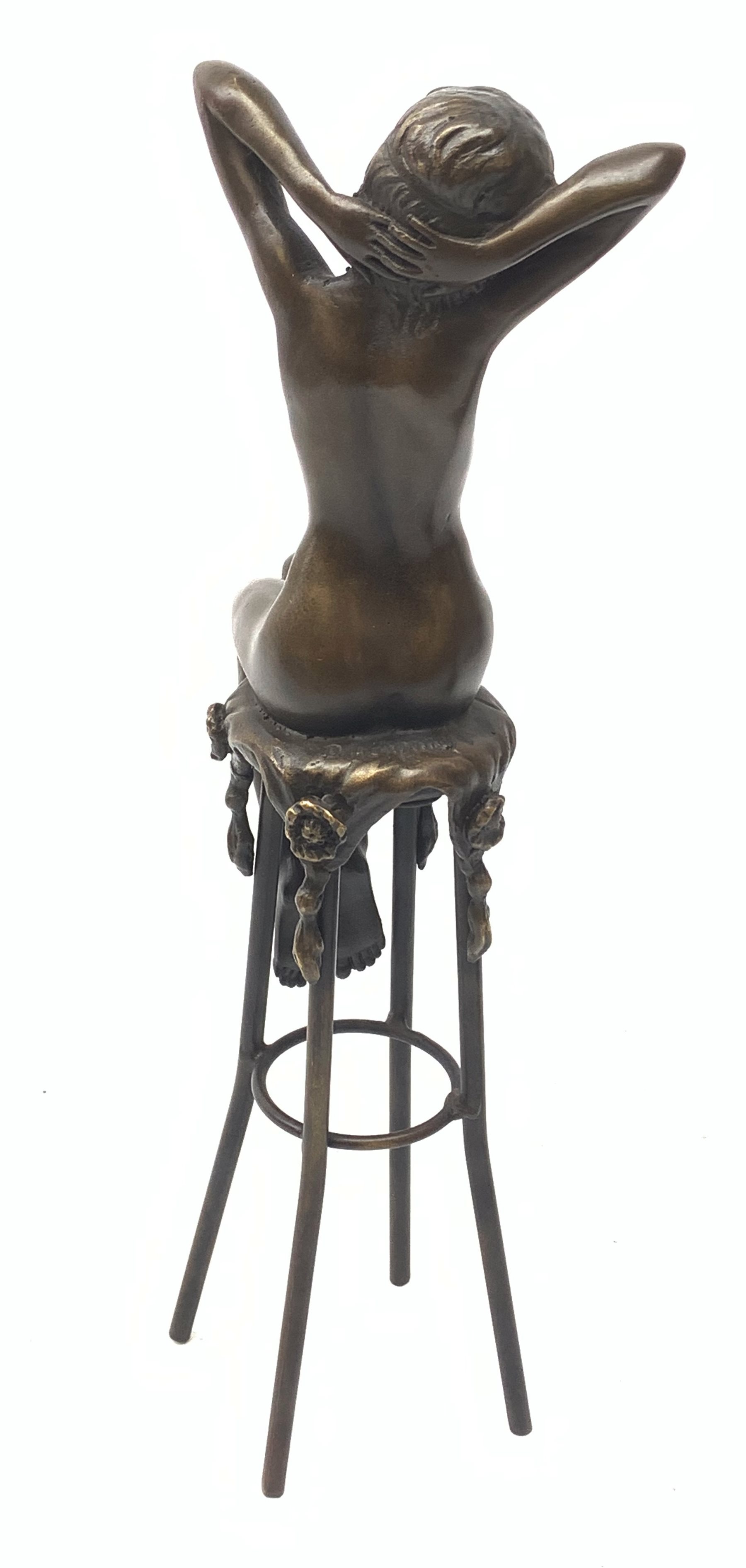After D H Chiparus, an Art Deco style bronze modelled as a nude female figure seated upon a chair, H28cm. 