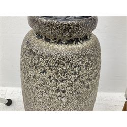 Two smooth polished ram horn handled Shepherd's crooks and a further similar example, together with various shooting sticks, walking sticks and canes, housed in a volcanic lava glaze West German style vase