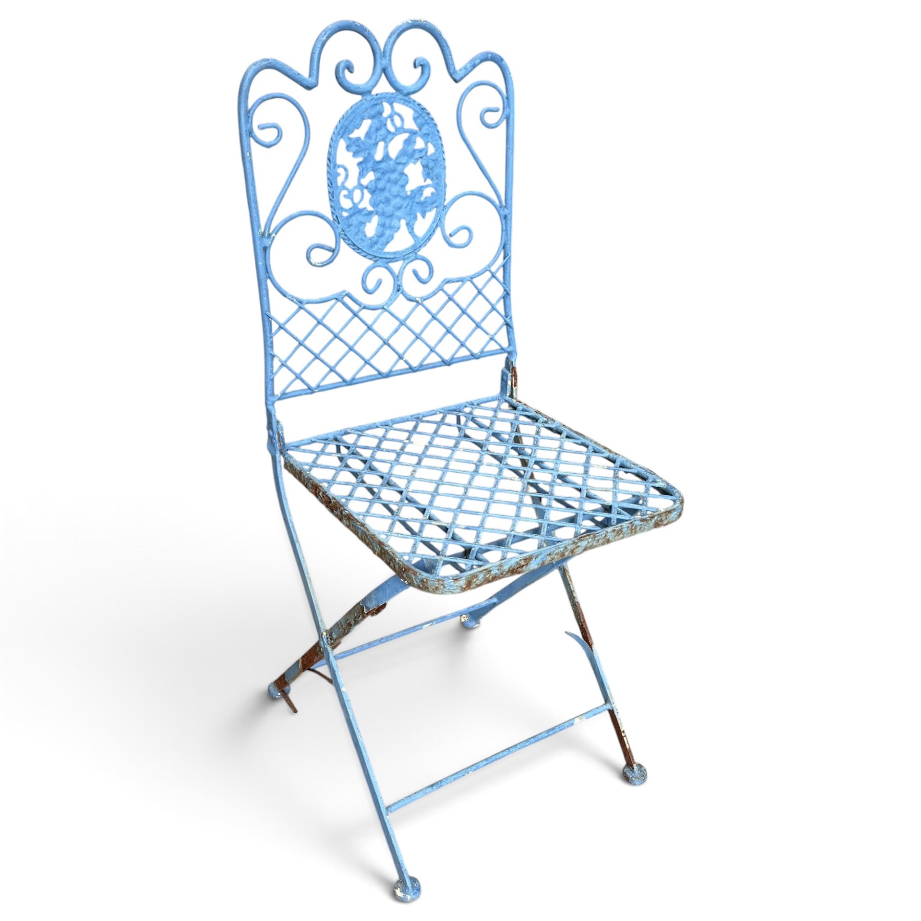 Three-piece French style blue-painted wrought iron garden bistro set, comprising a circular folding table with latticework top and central fruiting grapevine medallion (W71cm H76cm) and matching pair of chairs, with scrolling cresting rail and grapevine motif over folding X-frame base (W40cm H98cm)
