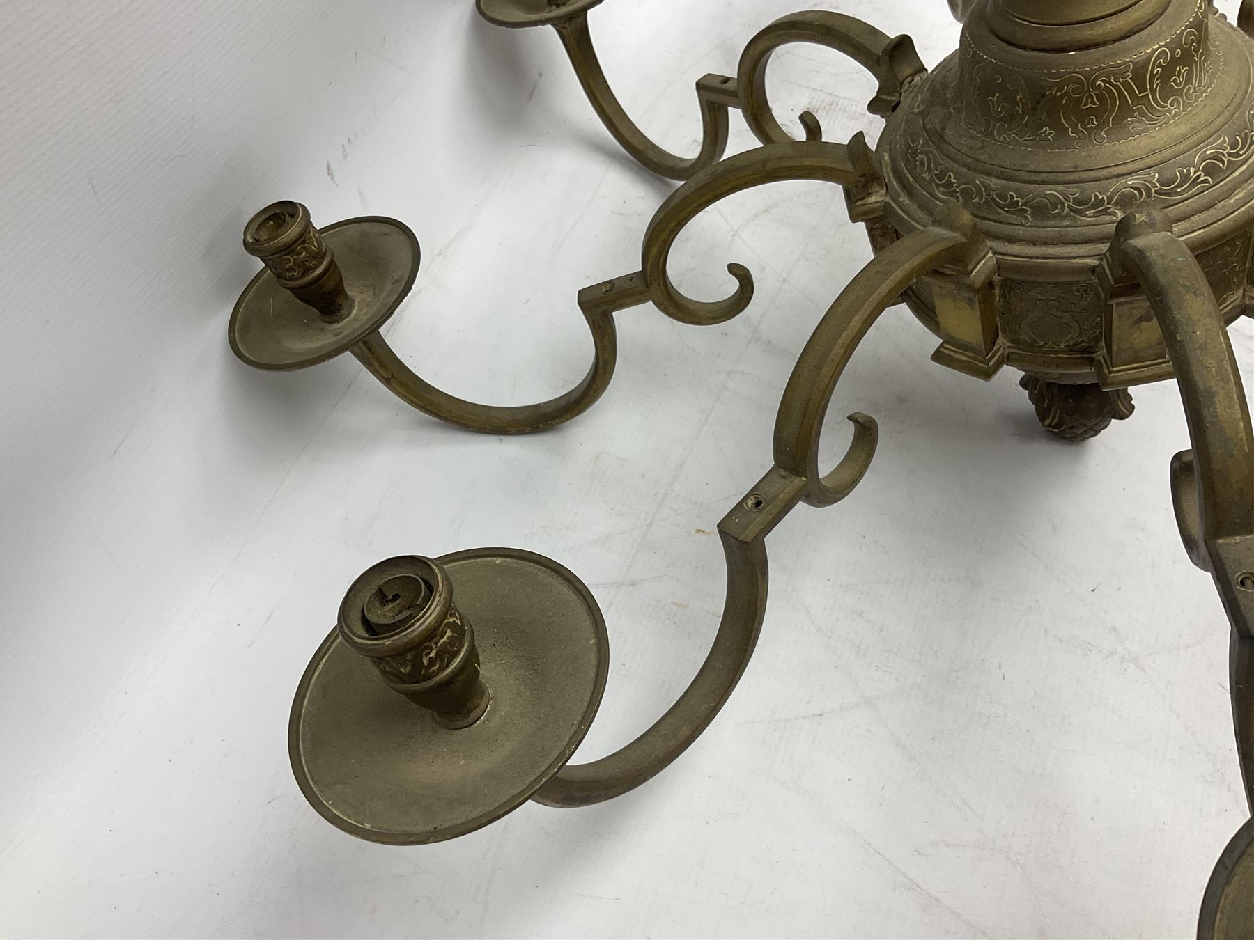 20th century heavy brass eight branch electrolier, detailed with putti masks, approximately H60cm W71cm