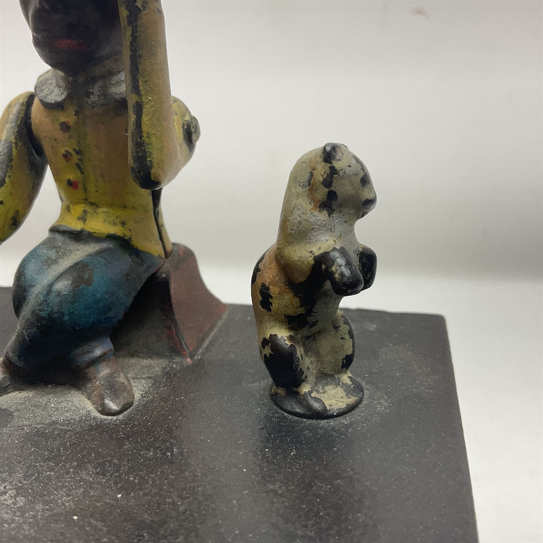 American 'Organ Bank' musical cast-iron mechanical money bank with hand cranked action and seated figure with two dancing dogs on top; locking door to base (no key); marked to the back 'Pat June 13 1882', H19cm