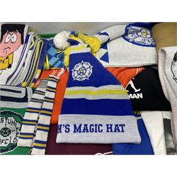 Collection of Leeds United scarves, hats and t-shirts, together with a Washington Redskins NFL sweatshirt and an Australian rugby league shirt