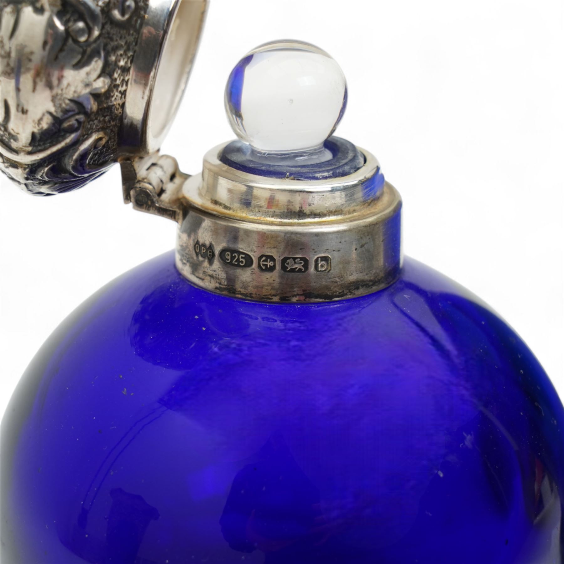Late Victorian blue glass trumpet shape vase in pierced silver frame H20cm Birmingham 1899, modern blue glass globe scent flask with silver cover, two cranberry glass beakers in silver frames, cranberry sugar bowl in silver frame and blue glass sugar bowl with silver collar 