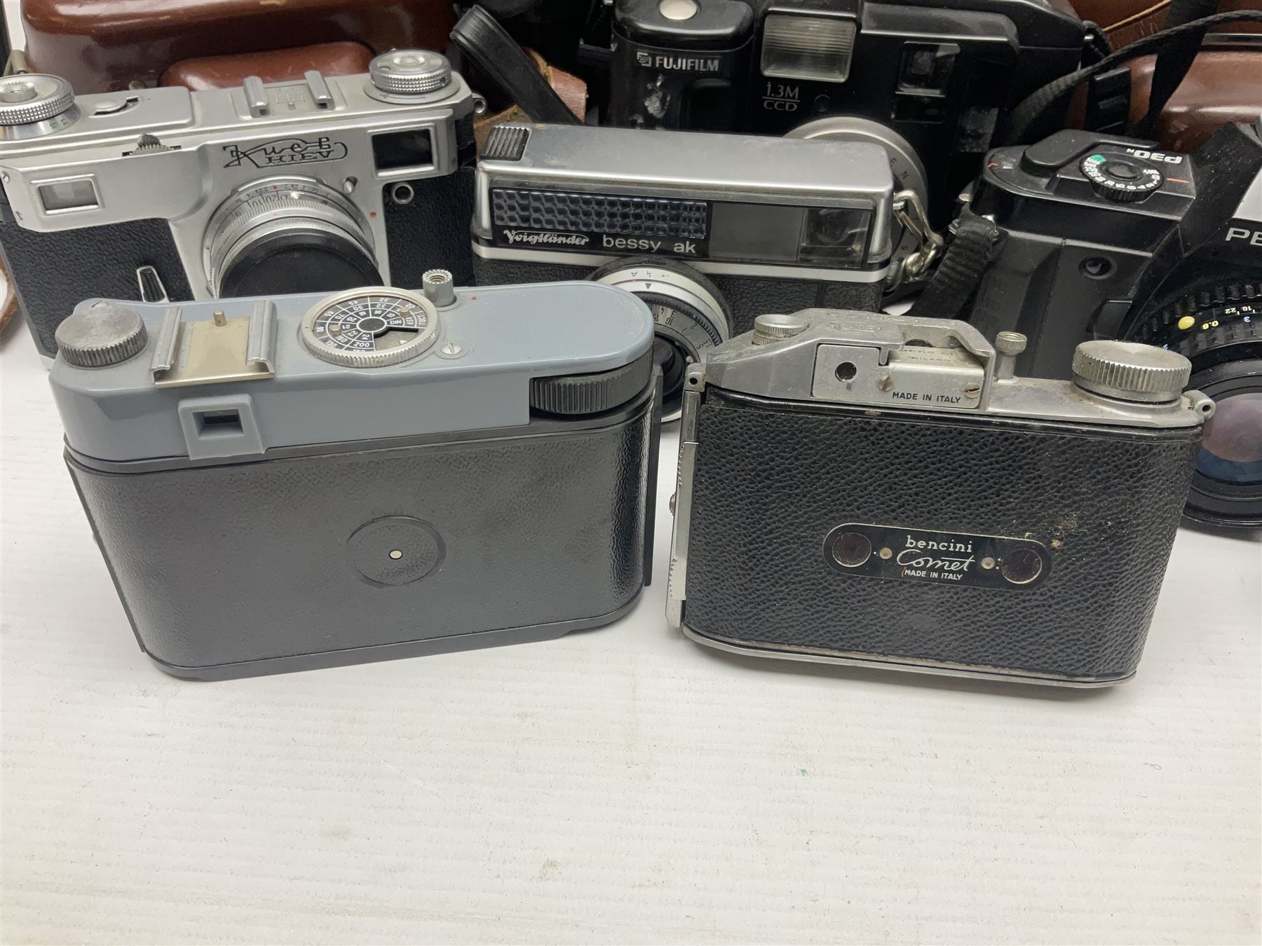 Collection of cameras and lenses, to include Pentax Program A camera body, serial no 123759, with 'Pentax-A zoom 1:3.5-4.5 28-80mm' len, Praktica EE2 camera body with 'Pentacon electric 1.8/50' lens etc, together with a Manfrotto tripod 