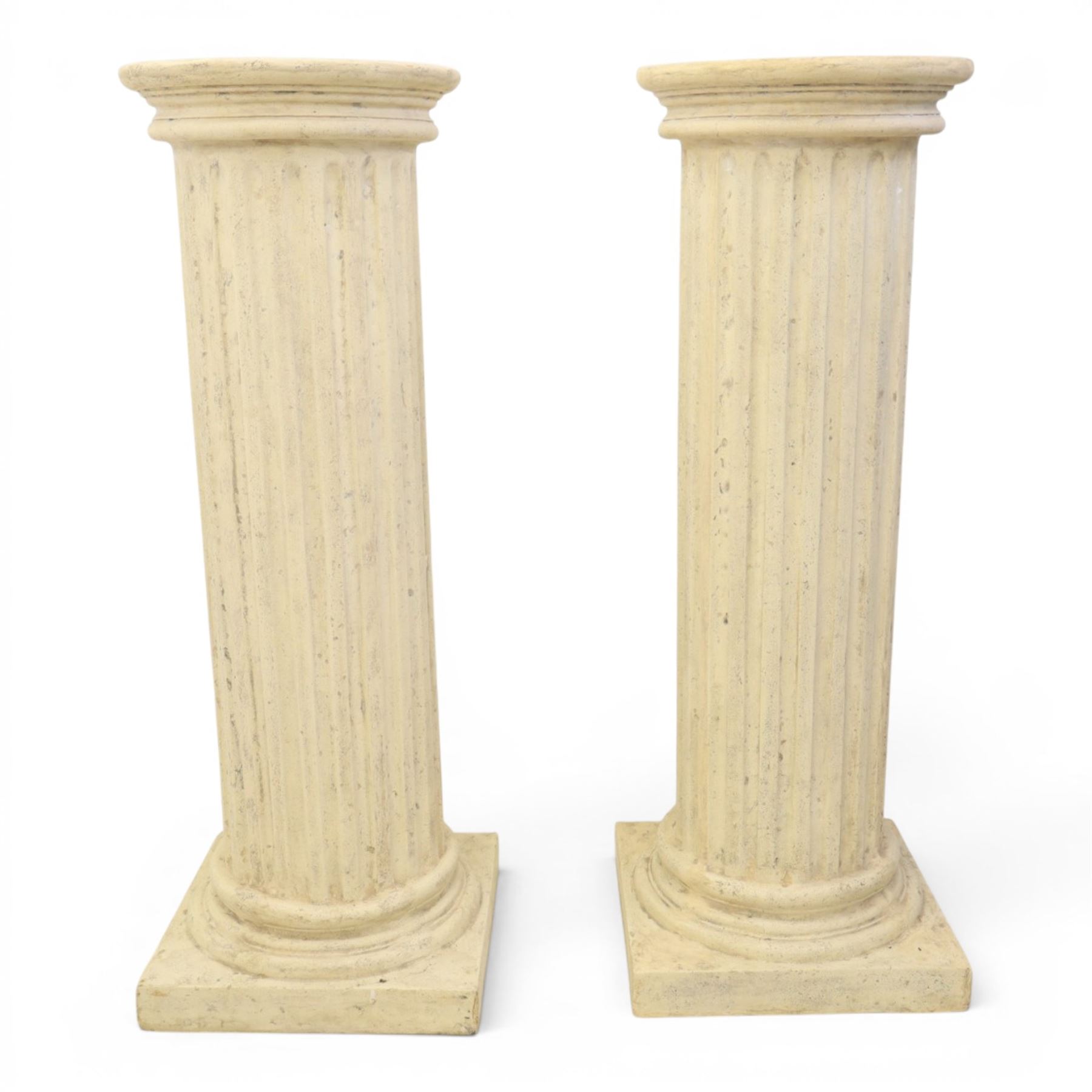 Pair of Regency style composite stone column pedestals, with fluted cylindrical columns and moulded capitals and bases, on square plinths