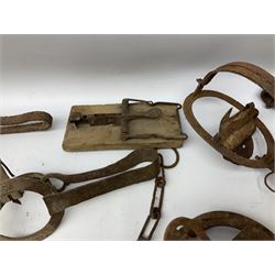 Quantity of animal traps including, gin traps, mole traps, Henri Marty wirework cage trap etc. Auctioneer's Note: These traps are sold as artefacts for ornamental purposes only as the use of some of them is illegal.