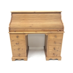 Solid pine twin pedestal shaped tambour roll top desk, fitted interior, eight drawers, shaped plinth base, W117cm, H111cm, D55cm