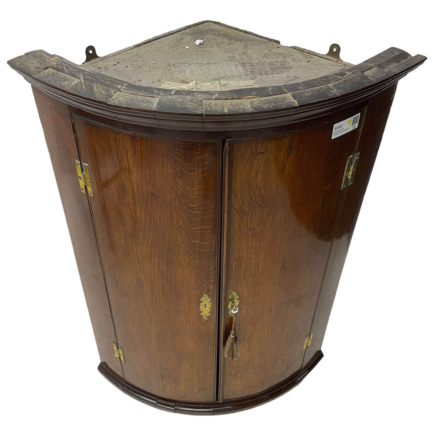 George III oak and mahogany wall hanging cylinder corner cupboard, moulded cavetto cornice over double cupboard enclosing three shelves