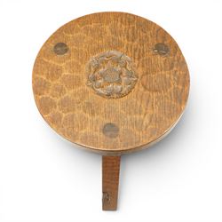 Gnomeman - circular adzed oak stool with carved Yorkshire Rose top, raised on three shaped supports carved with gnome signature, by Thomas Whittaker, Littlebeck, Whitby