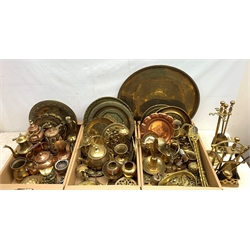 A large collection of assorted brass and copper, to include a large Eastern brass charger, D57.5cm, a number of further Eastern and other brass chargers and plates, quantity of mounted and unmounted horse brasses, teapots, figures, etc. 