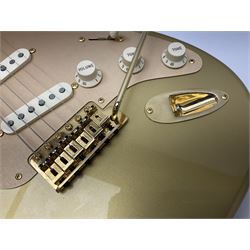 Fender Stratocaster 50th Anniversary 2004 metallic gold electric guitar; serial no.MZ4116369; L98cm; in Spider fitted case with owners manual and other paperwork, strap and belt buckle etc