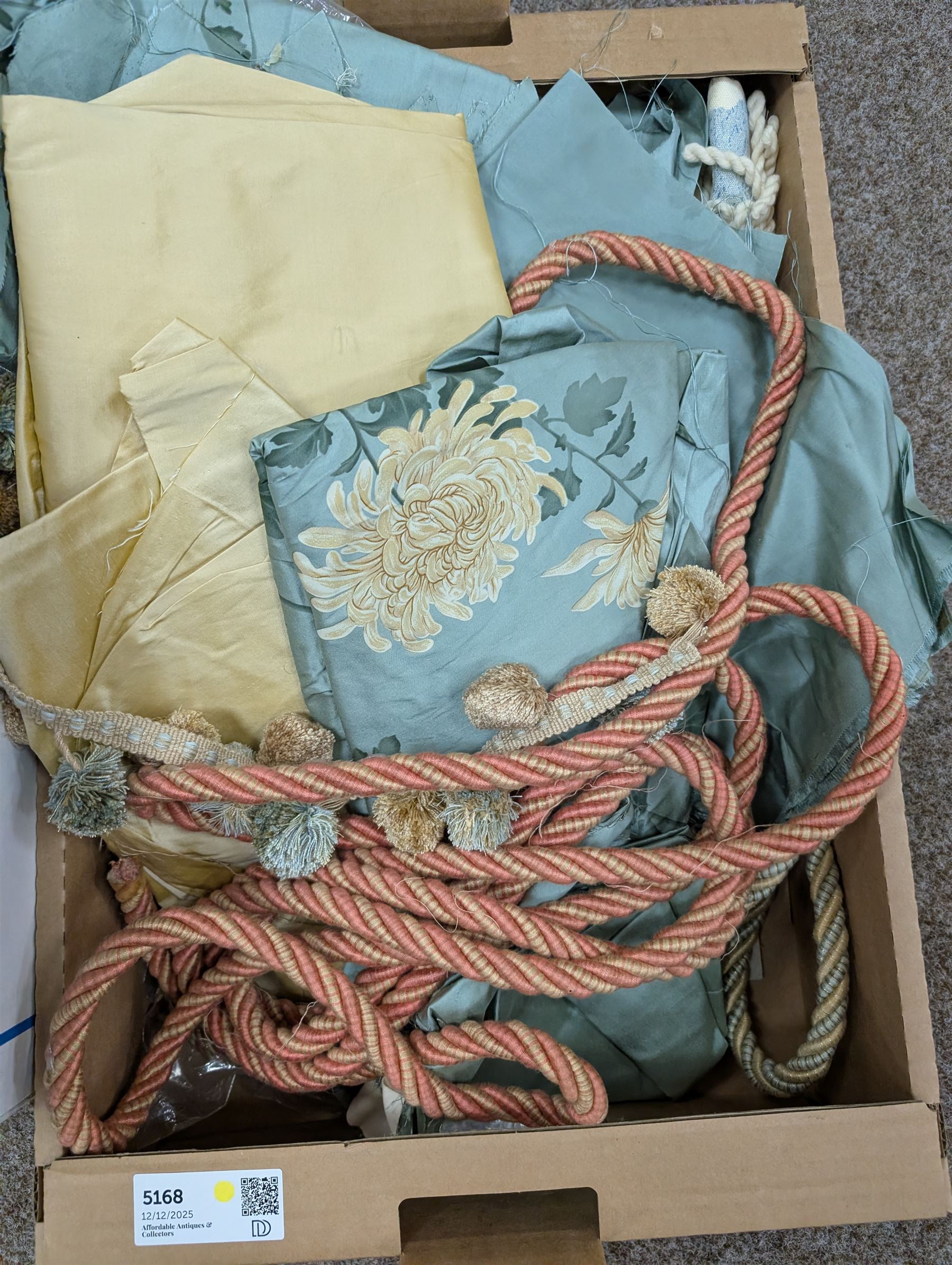 Collection of curtain fabric pieces and tassels