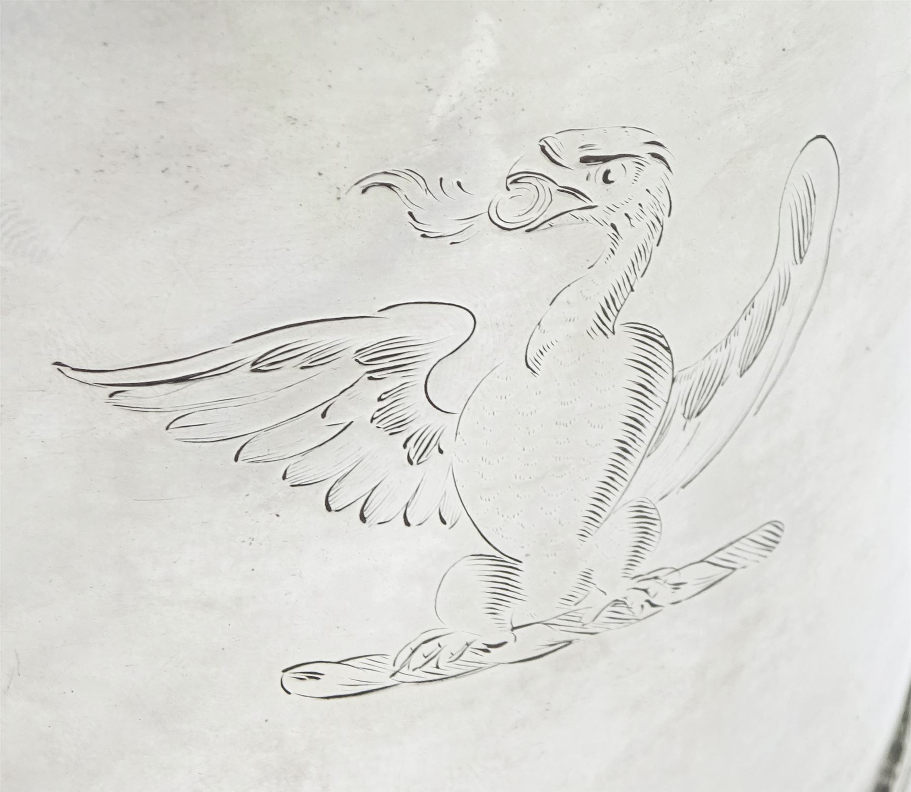 Queen Anne silver tankard, of plain tapering cylindrical form, with stepped and flat-domed cover, twit cast thumbpiece and curved handle, the body engraved with eagle crest, hallmarked Abraham Barachin, Hull, circa 1706, the body and cover stamped once with makers mark and twice with town mark, H18cm, approximate weight 21.46 ozt (667.7 grams)
