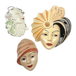 Three Art Deco wall masks, comprising two Crown Devon masks, inscribed  'painted by Dorothy Ann', and one Wedgwood Clarice Cliff mask