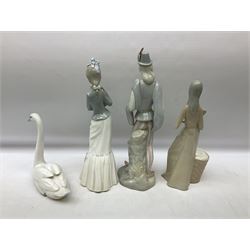 Lladro 'Walk With the Dog' figure no. 4893, together with Lladro swan figure, Porceval figure of a gentleman with a bird perched upon his hand and a further of a lady with flowers beside a basket, all with marks beneath, tallest H40cm