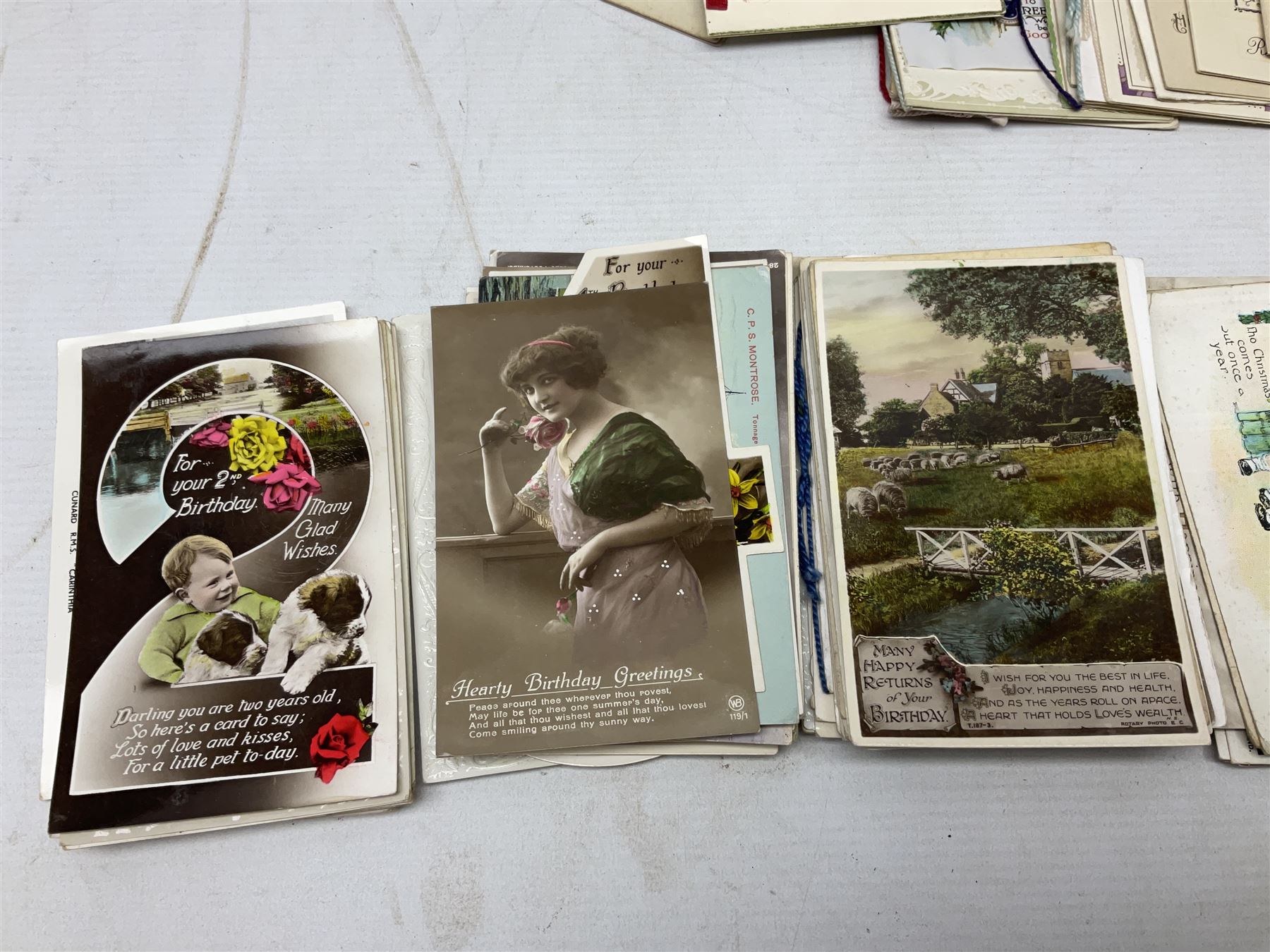 Victorian scrap album, well stocked with greeting cards and scraps; ten WW1 French embroidered silk postcards/greeting card including envelope type with greeting card insets; and large quantity of Edwardian and later postcards and greeting cards including maritime, Bonzo, greeting etc