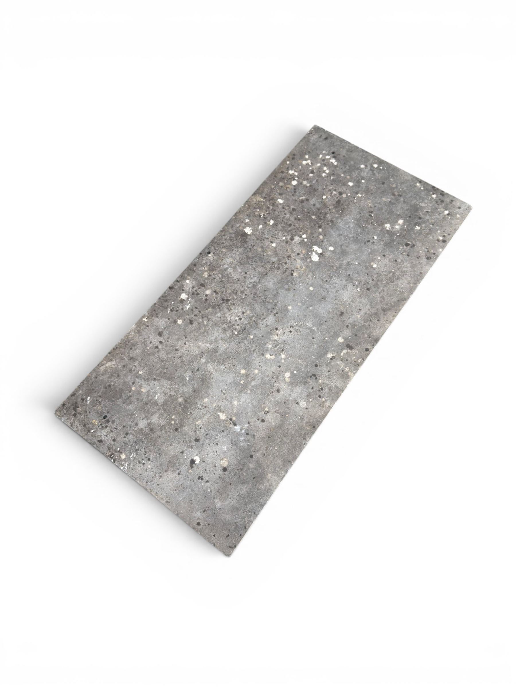 Victorian cast iron garden table, rectangular slate top raised on pierced scrolling foliate end supports with urn and column designs, united by a spindle support stretcher with scrolling acanthus spandrels, stamped 'Registered Design' with indistinct number, in distressed white painted finish