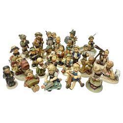 Twenty six Hummel figures by Goebel, to include Fire Fighter, Band Leader and Spring Sowing