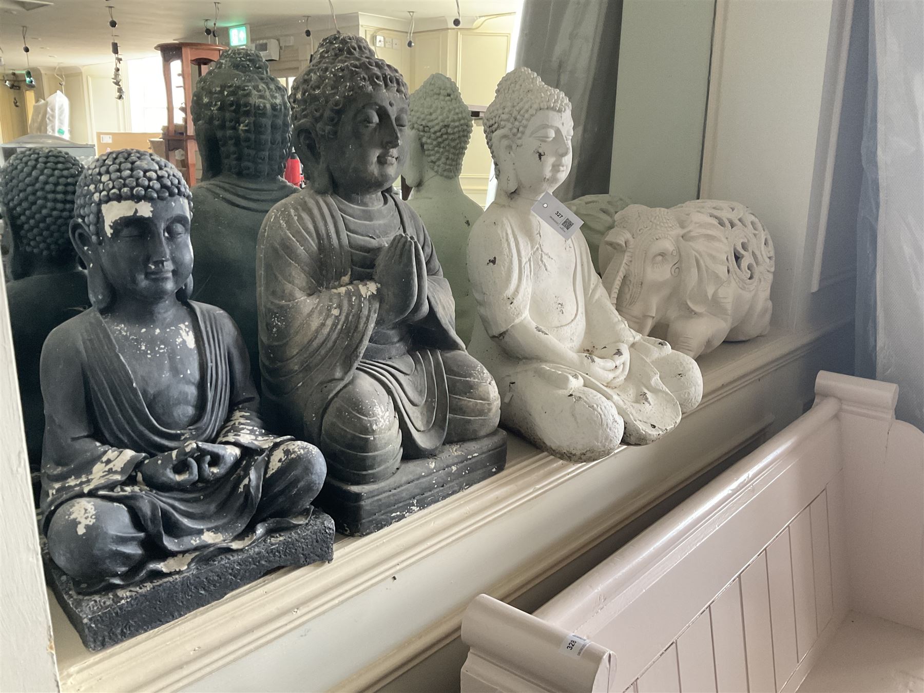 Three cast seated Buddhas and an elephant (4)- LOT SUBJECT TO VAT ON THE HAMMER PRICE - To be collected by appointment from The Ambassador Hotel, 36-38 Esplanade, Scarborough YO11 2AY. ALL GOODS MUST BE REMOVED BY WEDNESDAY 15TH JUNE.