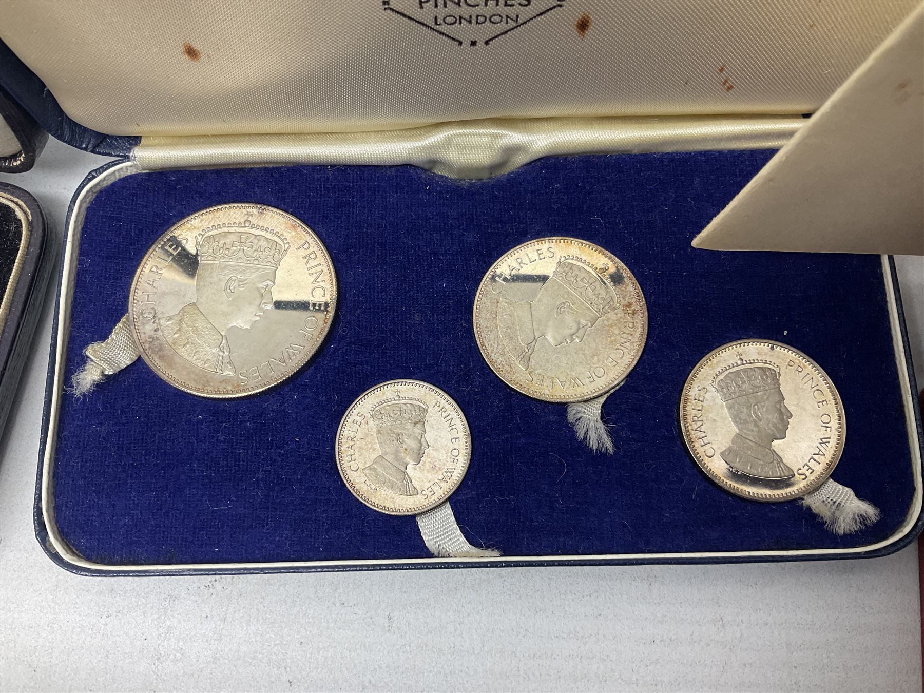 Commemorative coins and medallions, including hallmarked silver poultry medal, Royal Mint 'College of Arms Quincentenary Commemorative Medal', Selby Abbey '1069 1969' medallion, two medallions commemorating the Investiture of H.R.H. Prince Charles 1st July 1969 and a set of four coins commemorating the Investiture of Prince Charles, all cased 