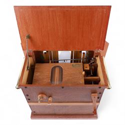 John Smith-20th century hand cranked portable street organ “music and mirth” in a wooden case with carrying handles, with speaking pipes and mannequin to the front. All pipes present, however the mechanism is in need of restoration. With five paper music rolls.