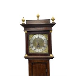 John Kemp of Yoxford (Suffolk) - 18th century oak 30 hour longcase clock c1770, with a later box top and finials, square hood door with attached pilasters and gesso capitals, long flat topped trunk door with a rectangular plinth and bracket feet, brass dial with cast spandrels and engraved dial centre, silvered chapter ring with Roman numerals and five minute Arabic's, with matching steel hands, birdcage chain driven movement with a recoil anchor escapement and count wheel striking. With weight and pendulum.
