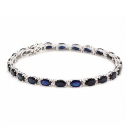 18ct white gold sapphire and diamond bracelet, twenty-three oval cut sapphires, each spaced by two round brilliant cut diamonds, stamped 750, total sapphire weight 14.00 carat, total diamond weight 0.88 carat