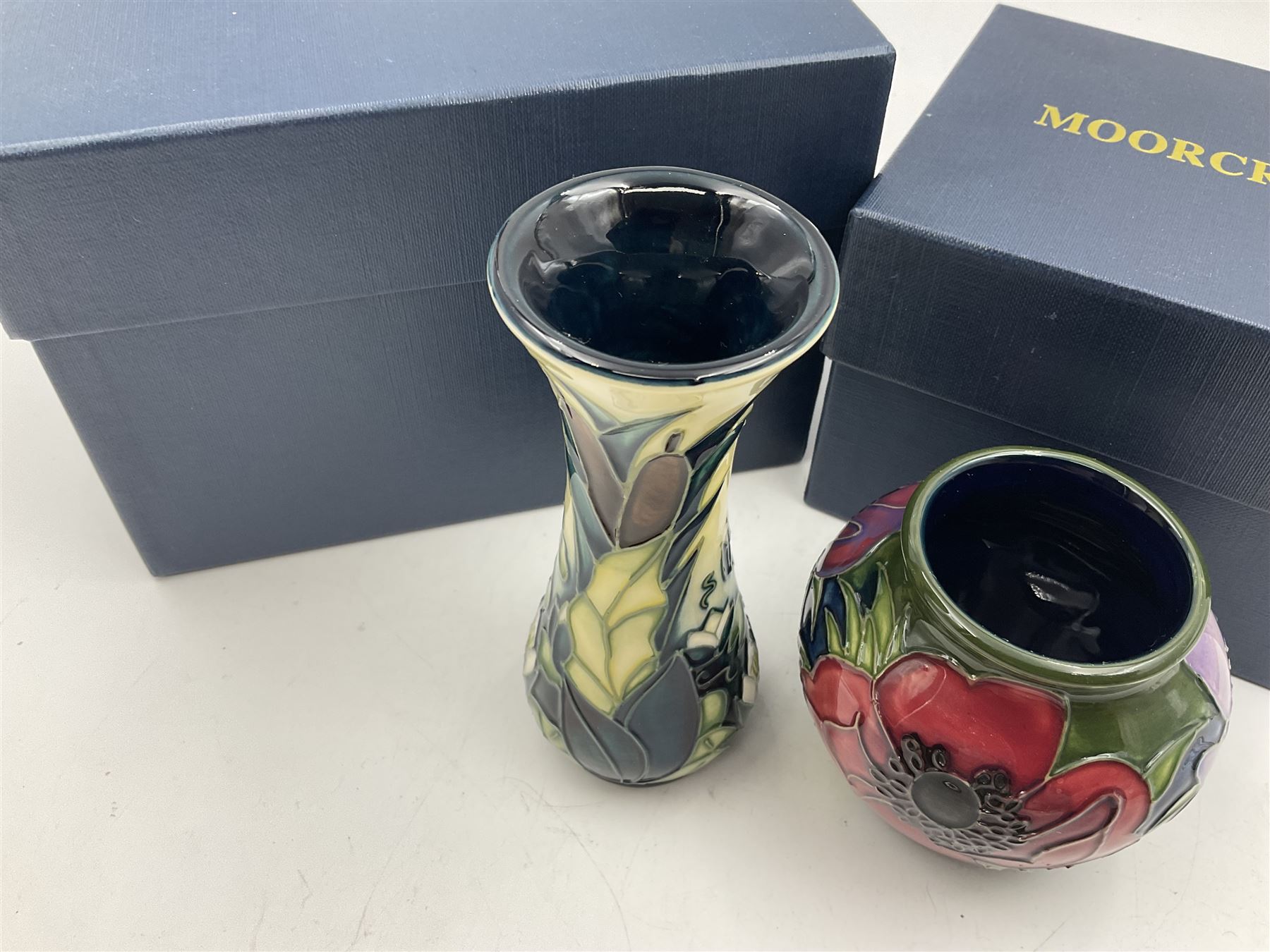 Two small Moorcroft vases, one decorated in the Lamia pattern by Rachel Bison, circa 1995, H13cm and the other in the Anemone Tribute pattern by Emma Bossons, circa 2002, H7.5cm, both with original boxes (2)