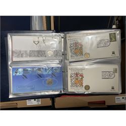 Approximately one hundred and fifteen Royal Mint coin covers, in two ring binder folders and loose, together with approximately 53 grams of Great British pre-1920 and approximately 68 grams of Great British pre-1947 silver threepence coins, and a small quantity of further pre-decimal coins