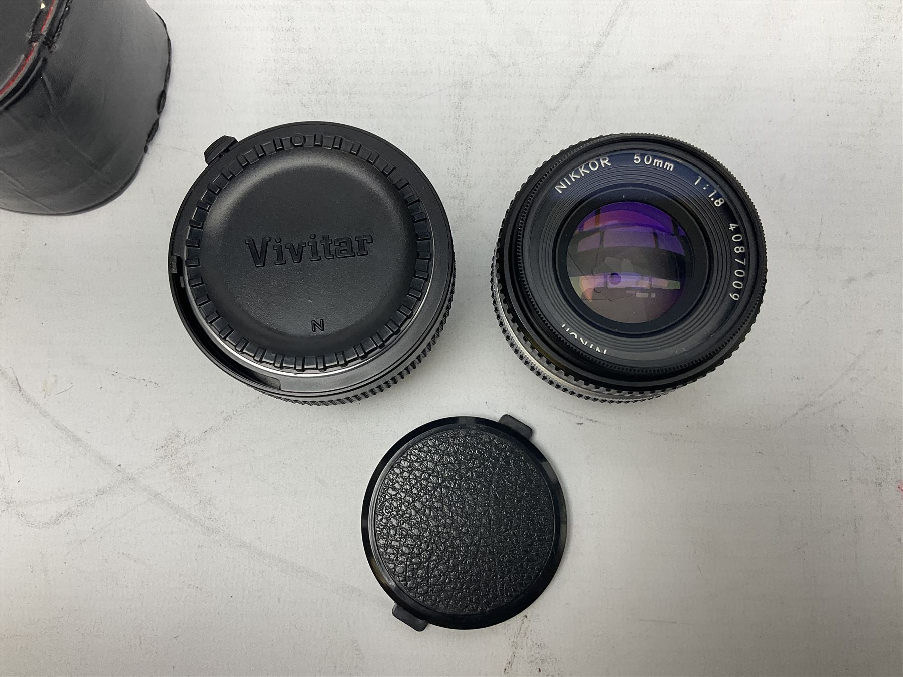 Nikon F3 SLR camera, serial number 1583609; Nikon 50mm 1:1.8 lens; Nikon 28-85mm 1:3.5-4.5 zoom lens; Vivitar MC 2X-3 Tele Converter, and a Nikon Speedlight SB-16 flash