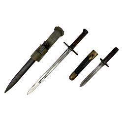 Italian Model 1891 Carcano knife bayonet with 30cm fullered steel blade, the cross-piece stamped VL1110; in steel scabbard with webbing frog L43cm overall; and another Italian fighting knife/bayonet in brass bound leather scabbard (2)